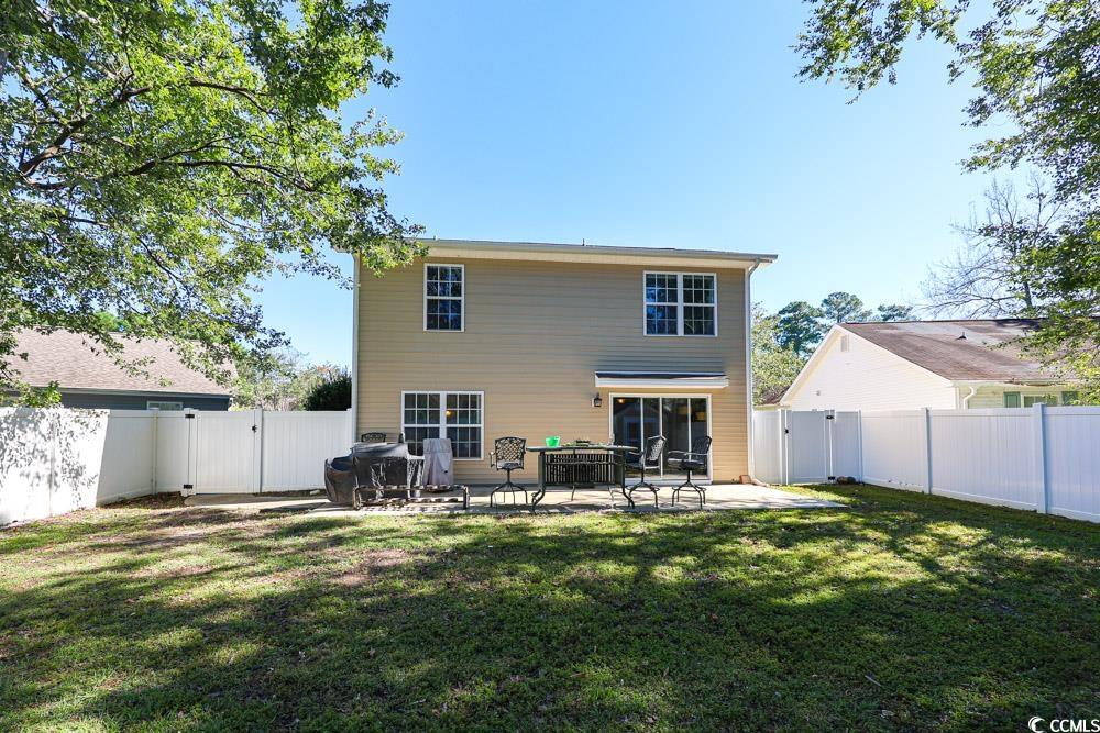 2033 Chadbury Lane Myrtle Beach, SC 29588 - Photo 30 of 39 Rear view of property featuring a gate, a patio area, and a fenced backyard