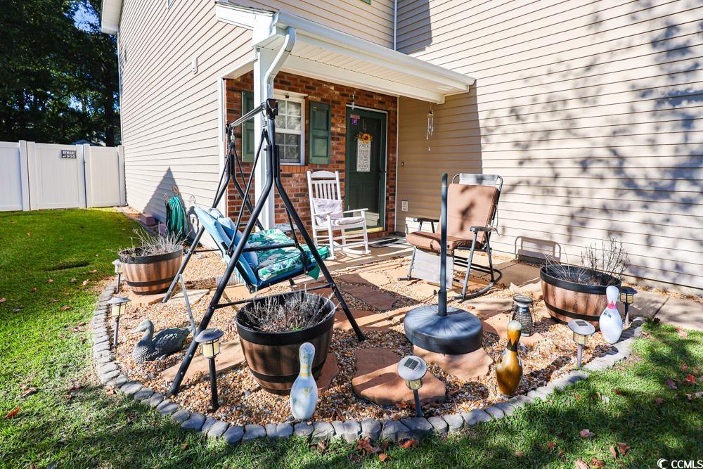 2033 Chadbury Lane Myrtle Beach, SC 29588 - Photo 35 of 39 View of patio featuring a fire pit and a gate