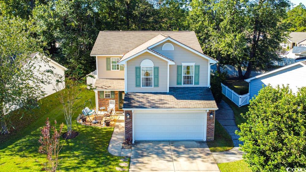 2033 Chadbury Lane Myrtle Beach, SC 29588 - Photo 39 of 39 Traditional home with driveway, an attached garage, brick siding, and a shingled roof