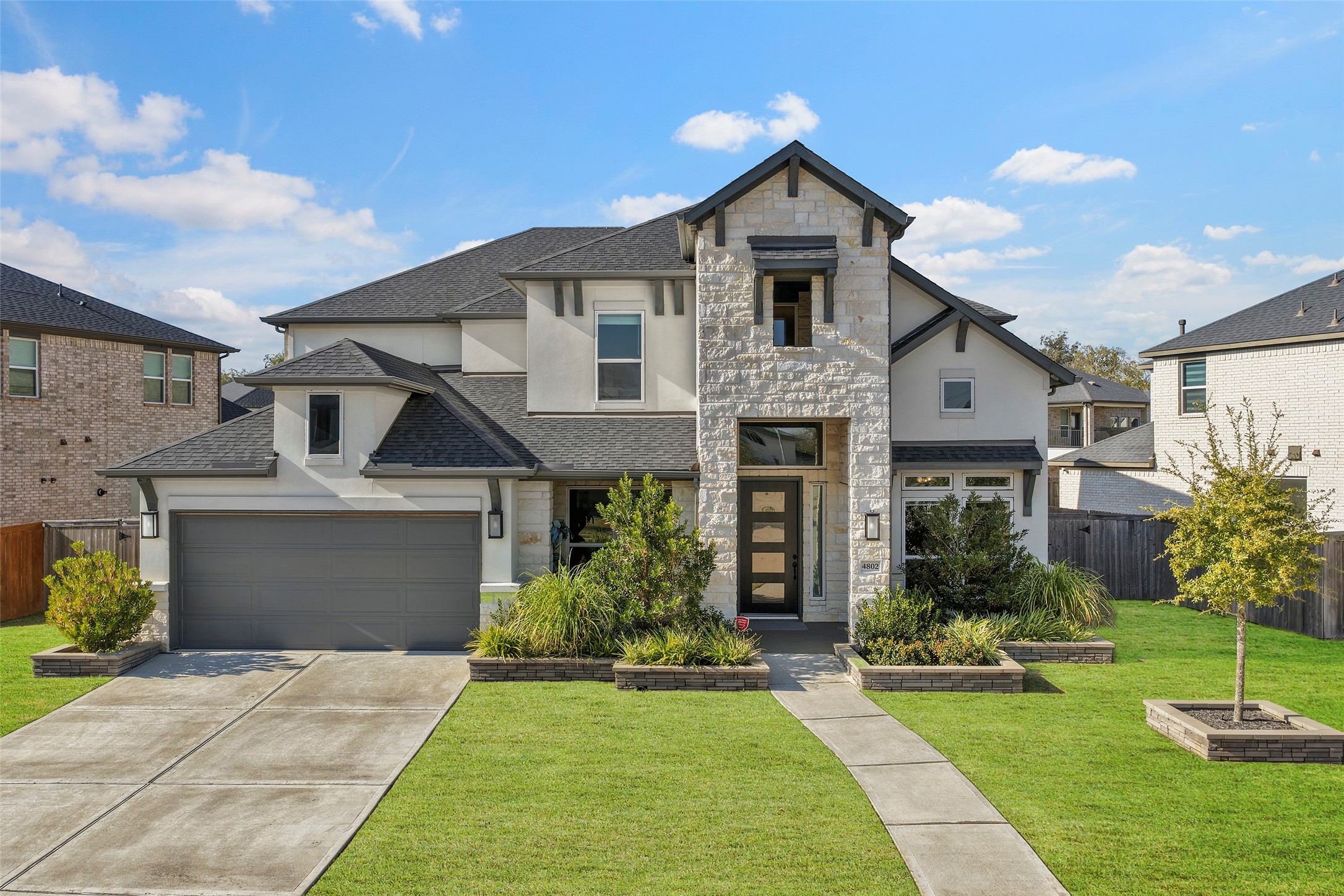 4802 Pecos Ridge Lane Sugar Land, TX 77479 - Photo 1 of 32 a front view of a house with a yard and trees