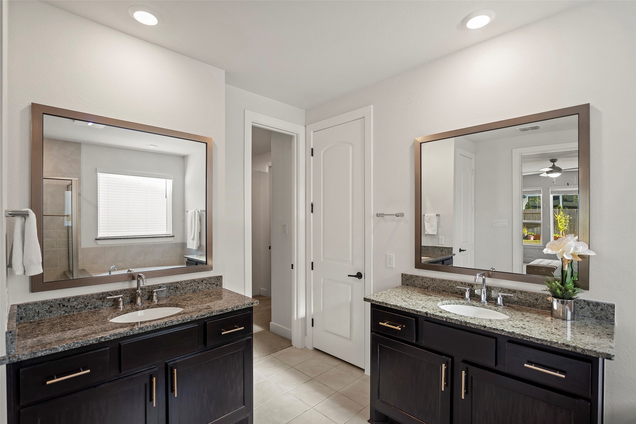 4802 Pecos Ridge Lane Sugar Land, TX 77479 - Photo 17 of 32 a bathroom with a granite countertop sink double and mirror