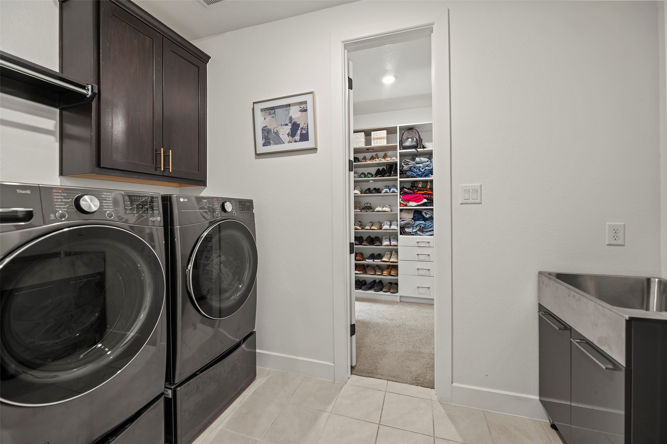 4802 Pecos Ridge Lane Sugar Land, TX 77479 - Photo 19 of 32 a view of a storage and utility room with washer and dryer