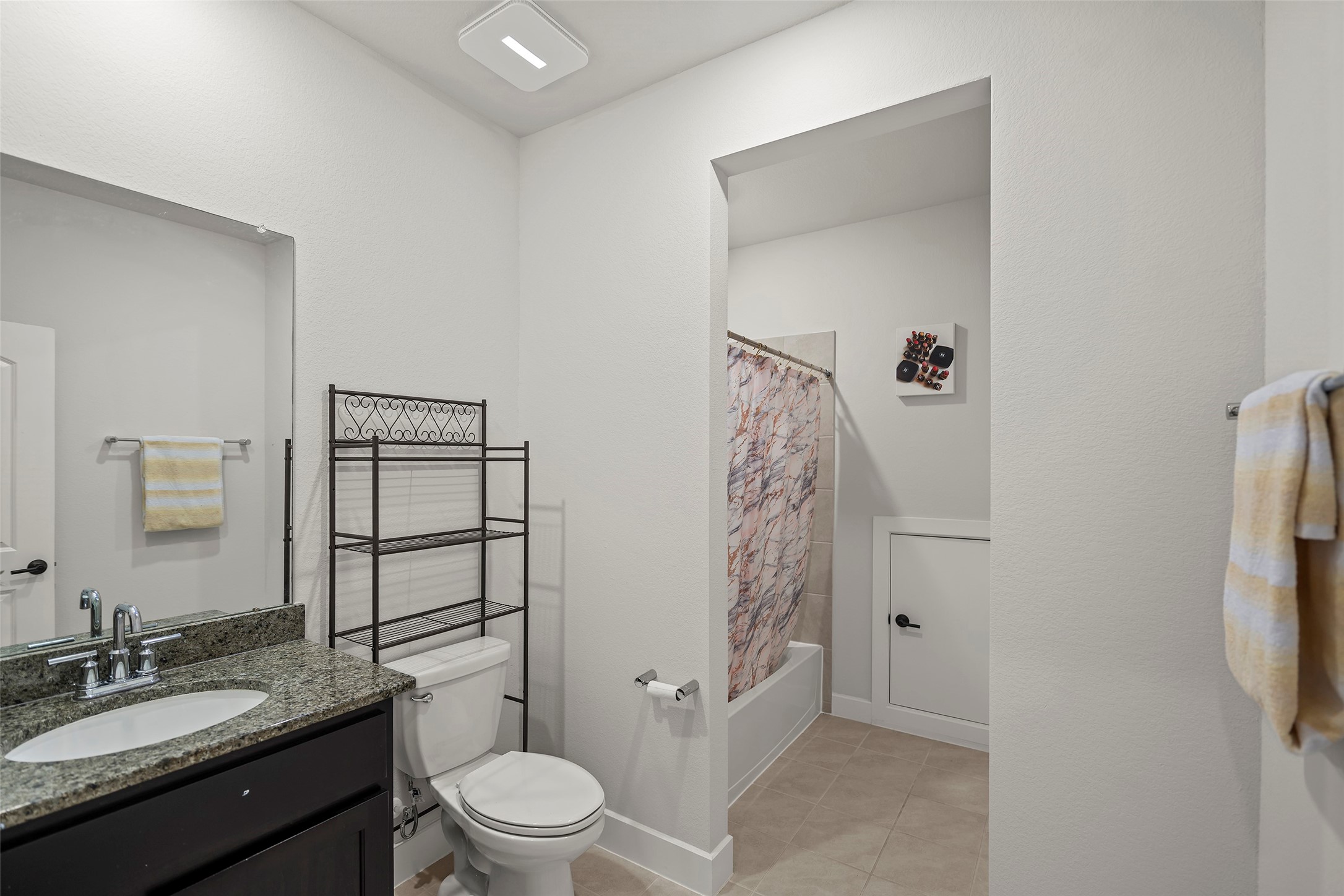 4802 Pecos Ridge Lane Sugar Land, TX 77479 - Photo 22 of 32 a bathroom with a granite countertop sink toilet and shower