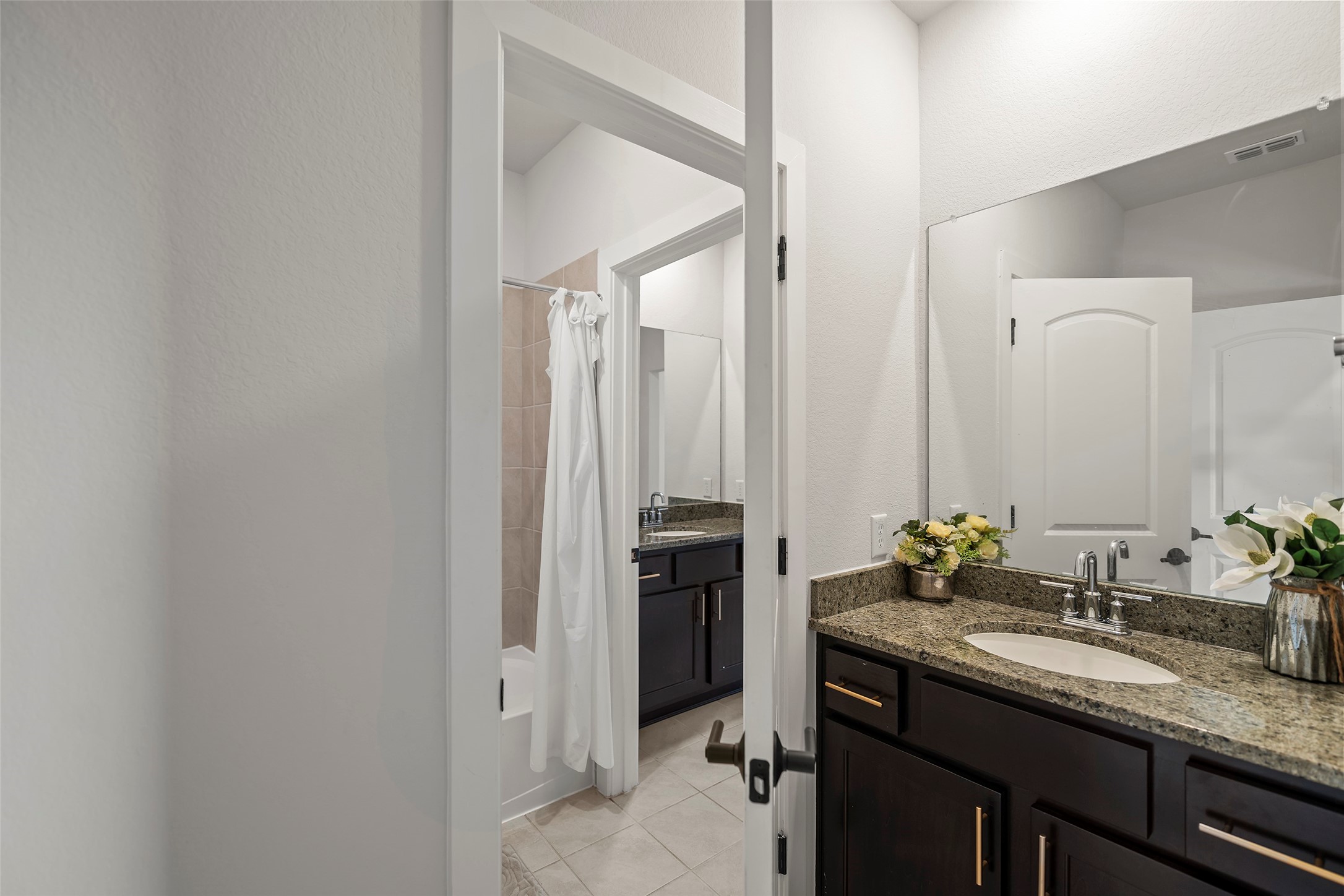 4802 Pecos Ridge Lane Sugar Land, TX 77479 - Photo 24 of 32 a bathroom with a granite countertop sink and a mirror