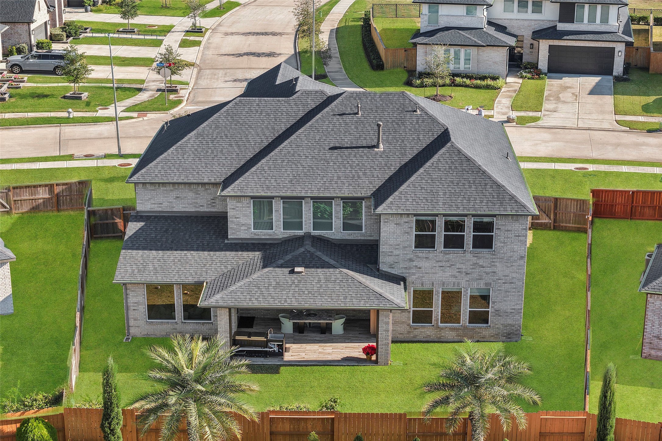 4802 Pecos Ridge Lane Sugar Land, TX 77479 - Photo 29 of 32 an aerial view of a house with garden space and swimming pool