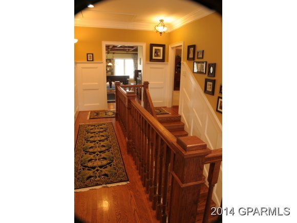 570 Jamaka Road Washington, NC 27889 - Photo 20 of 36 Upstairs Hallway-curved Banister Upstairs with Heavy Newell Posts and antique wainscoting