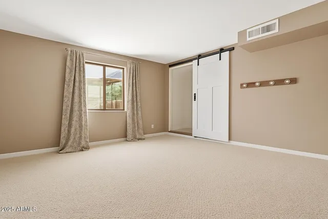 a view of a patio with table and chairs and potted plants