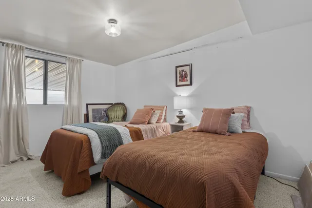 a view of a porch with chairs and backyard