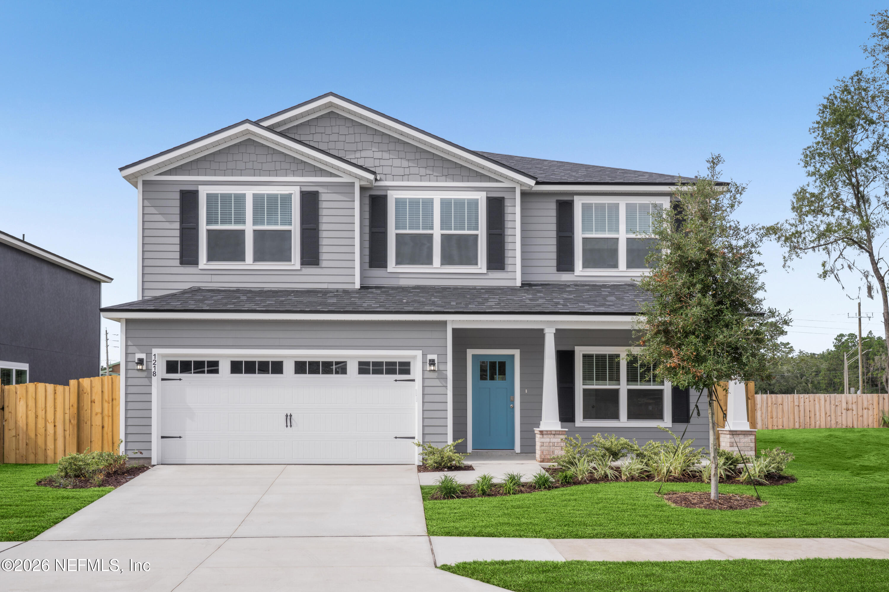1218 Jewelstone Lane Jacksonville, FL 32221 - Photo 1 of 53 a front view of a house with garden