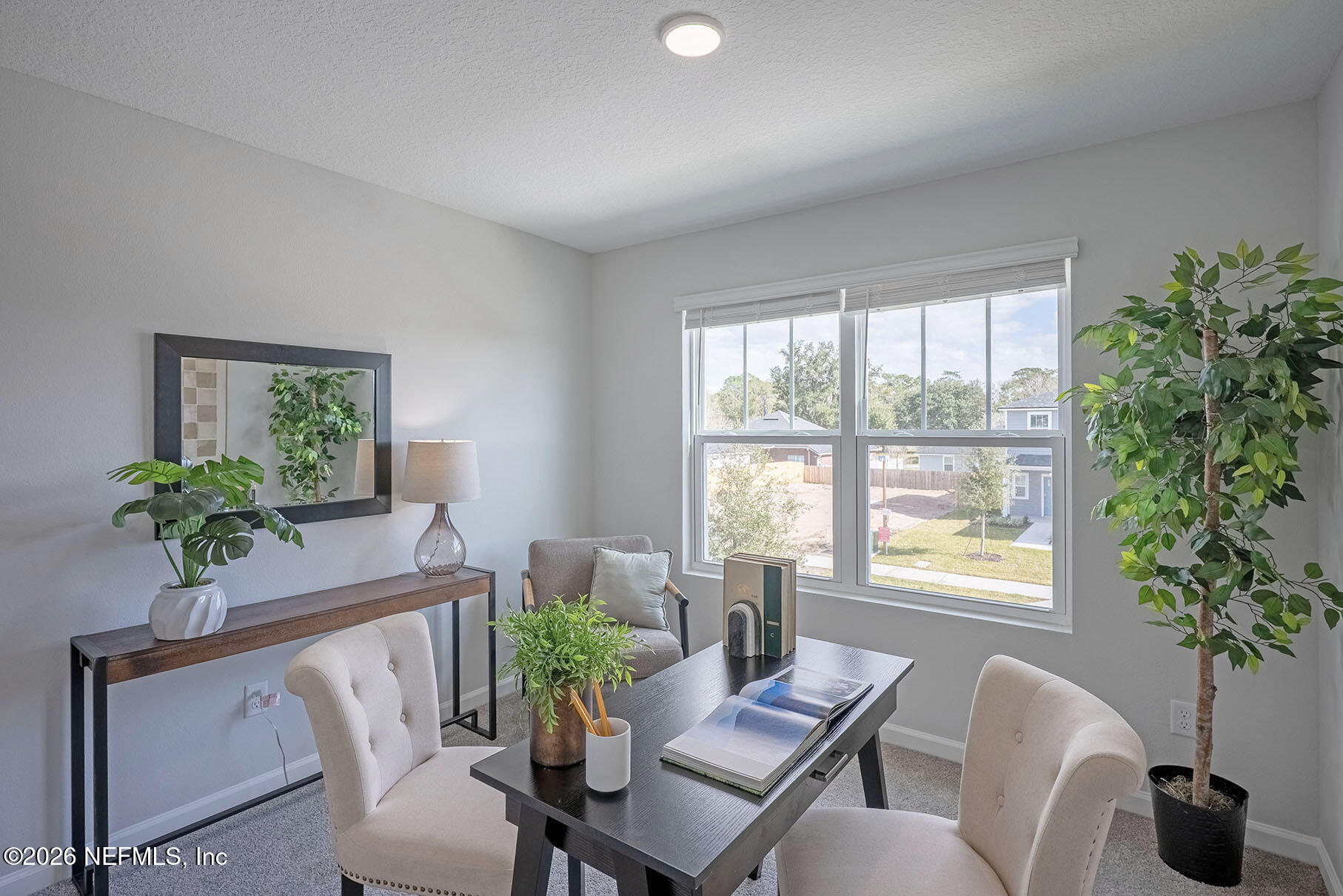1218 Jewelstone Lane Jacksonville, FL 32221 - Photo 34 of 53 a living room with furniture potted plant and a window