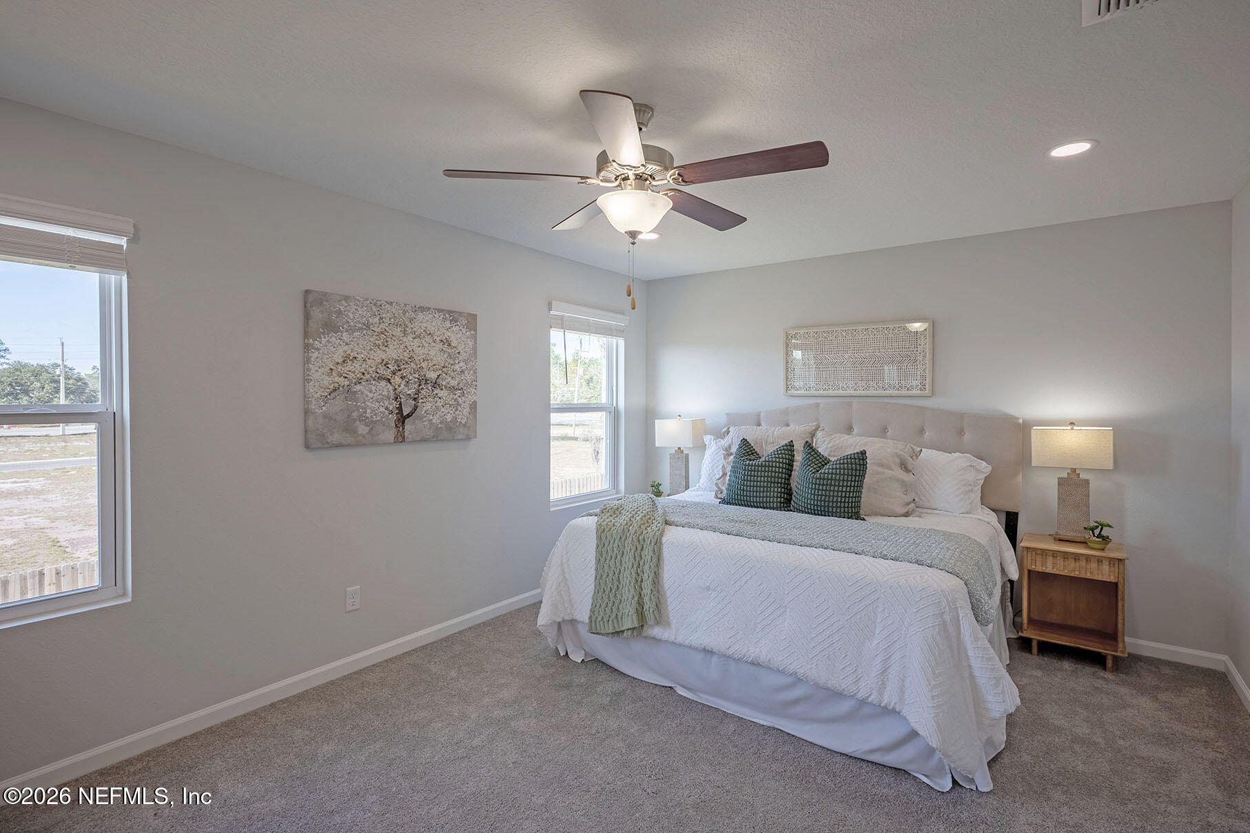 1218 Jewelstone Lane Jacksonville, FL 32221 - Photo 38 of 53 a bedroom with a bed and a chandelier