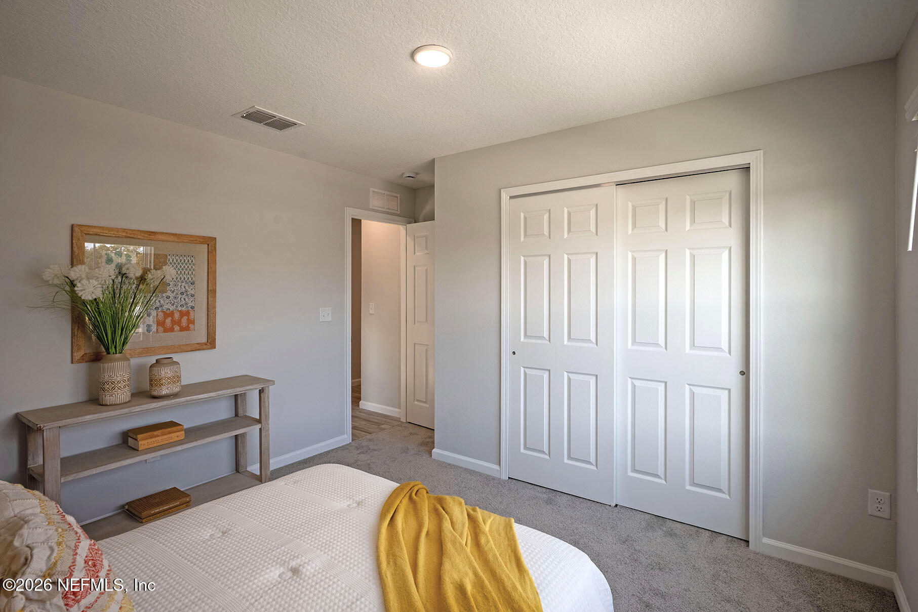 1218 Jewelstone Lane Jacksonville, FL 32221 - Photo 50 of 53 a spacious bedroom with a bed and a painting on the wall