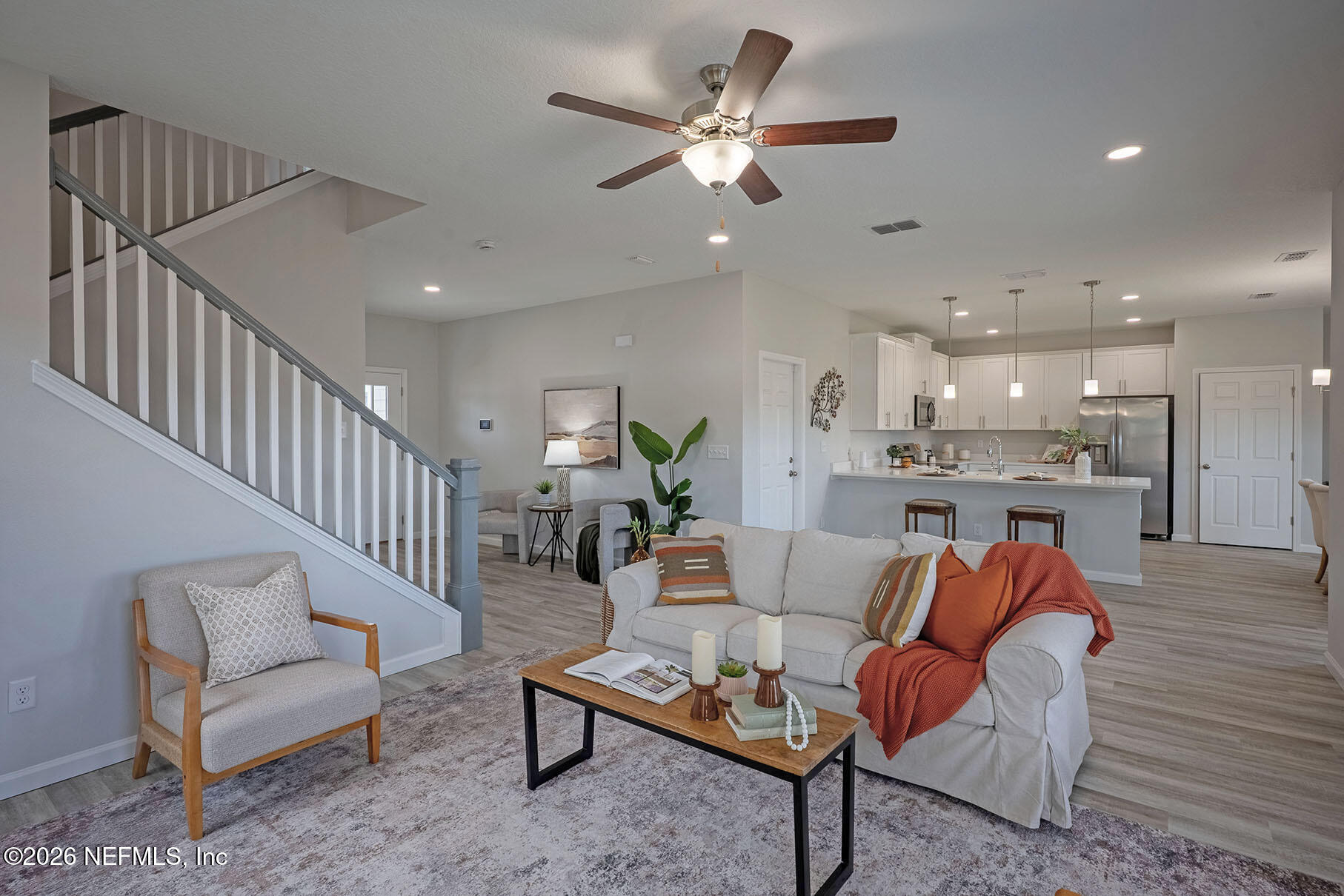 1218 Jewelstone Lane Jacksonville, FL 32221 - Photo 8 of 53 a living room with furniture kitchen view and a chandelier