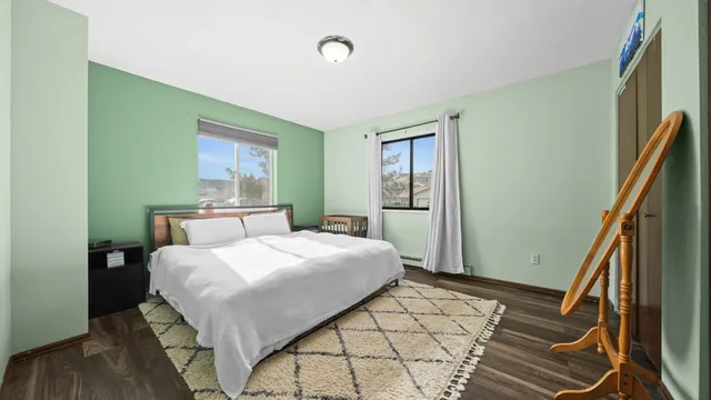 a bedroom with a bed and a dresser