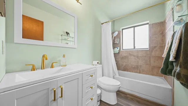 a bathroom with a sink a toilet and a bathtub