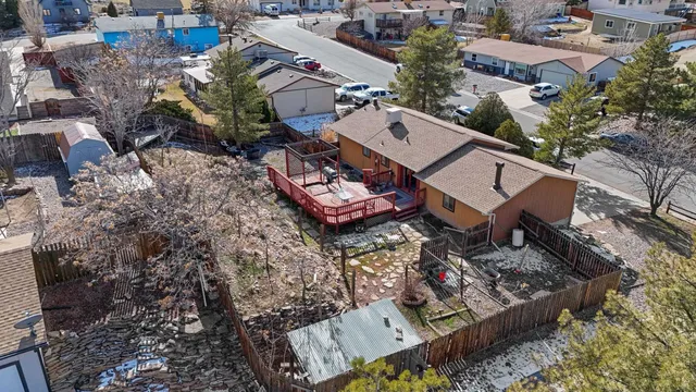 an aerial view of a house with a yard