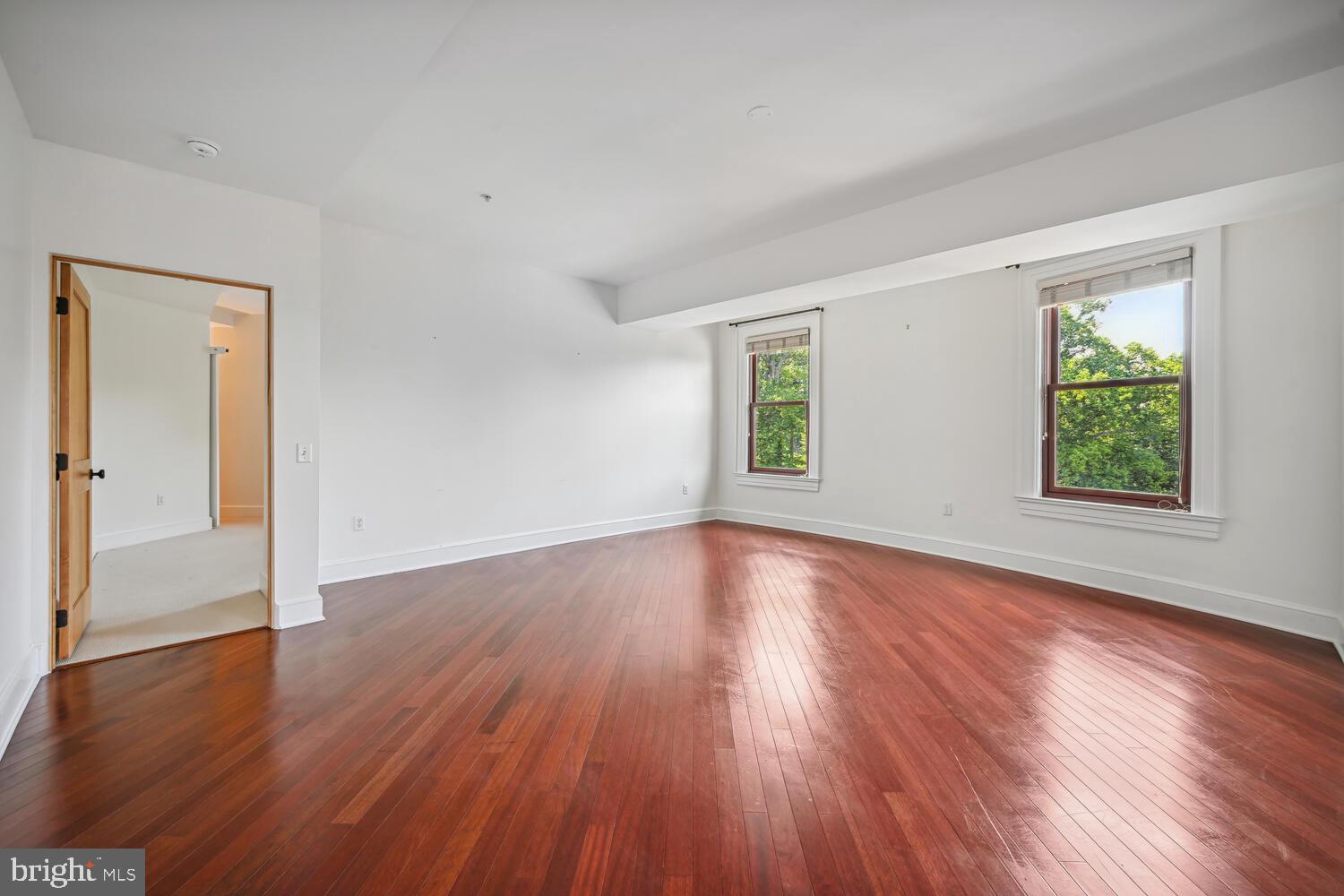 9610 Dewitt Drive, Unit B414 Silver Spring, MD 20910 - Photo 14 of 31 High ceilings, Sun-filled living & dining room