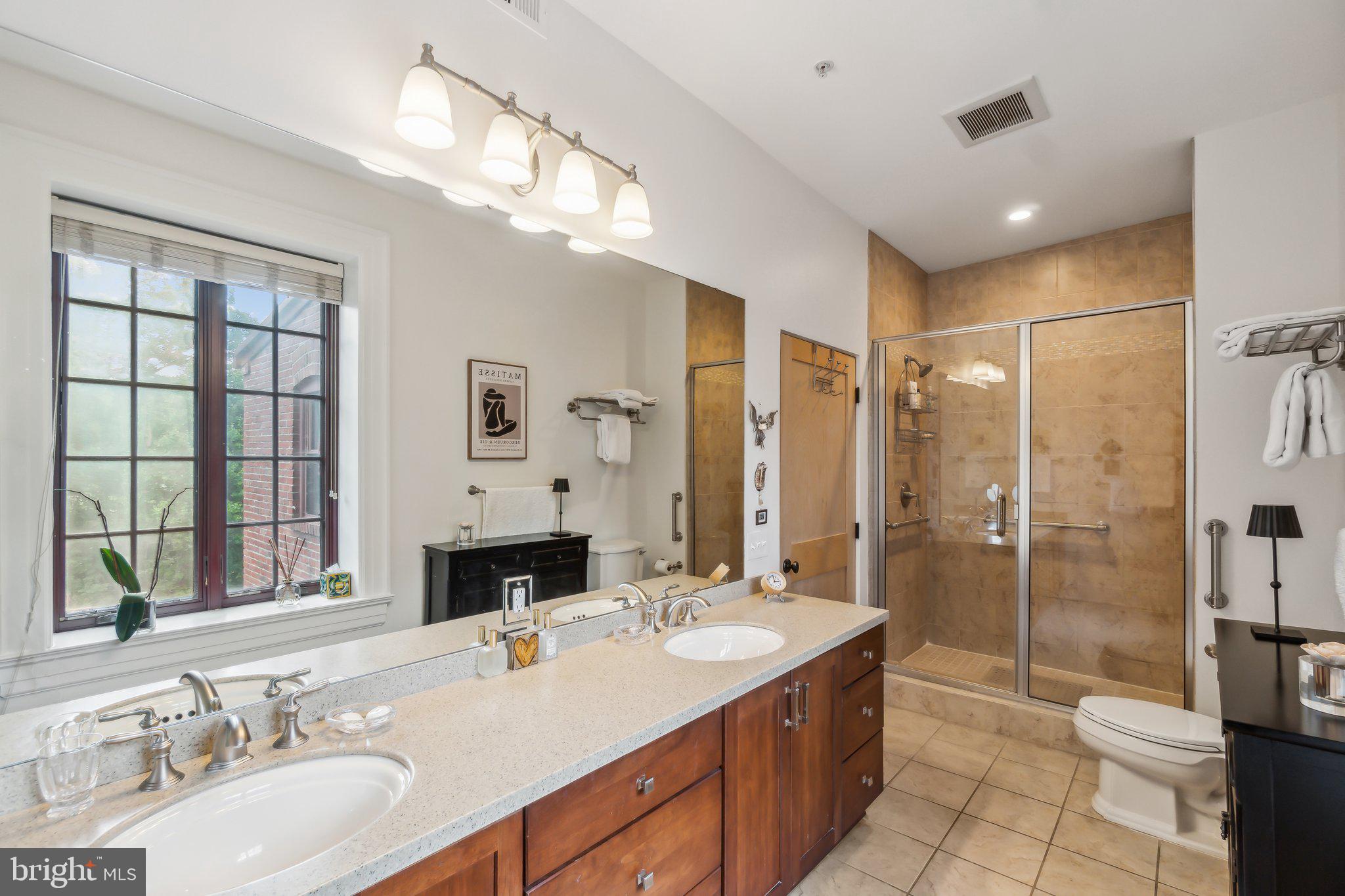 9610 Dewitt Drive, Unit B414 Silver Spring, MD 20910 - Photo 17 of 31 Double sink vanity primary bath with large window
