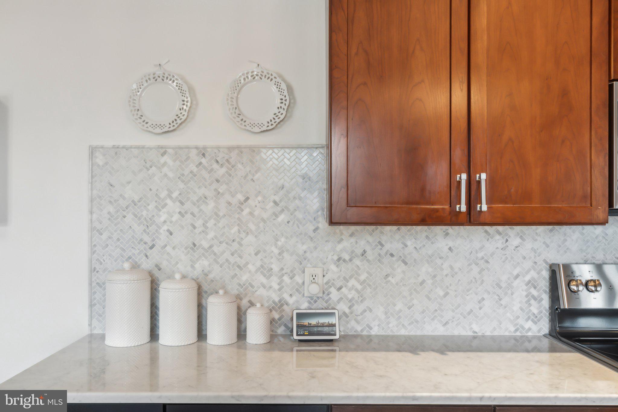 9610 Dewitt Drive, Unit B414 Silver Spring, MD 20910 - Photo 5 of 31 New Marble herringbone pattern backsplash