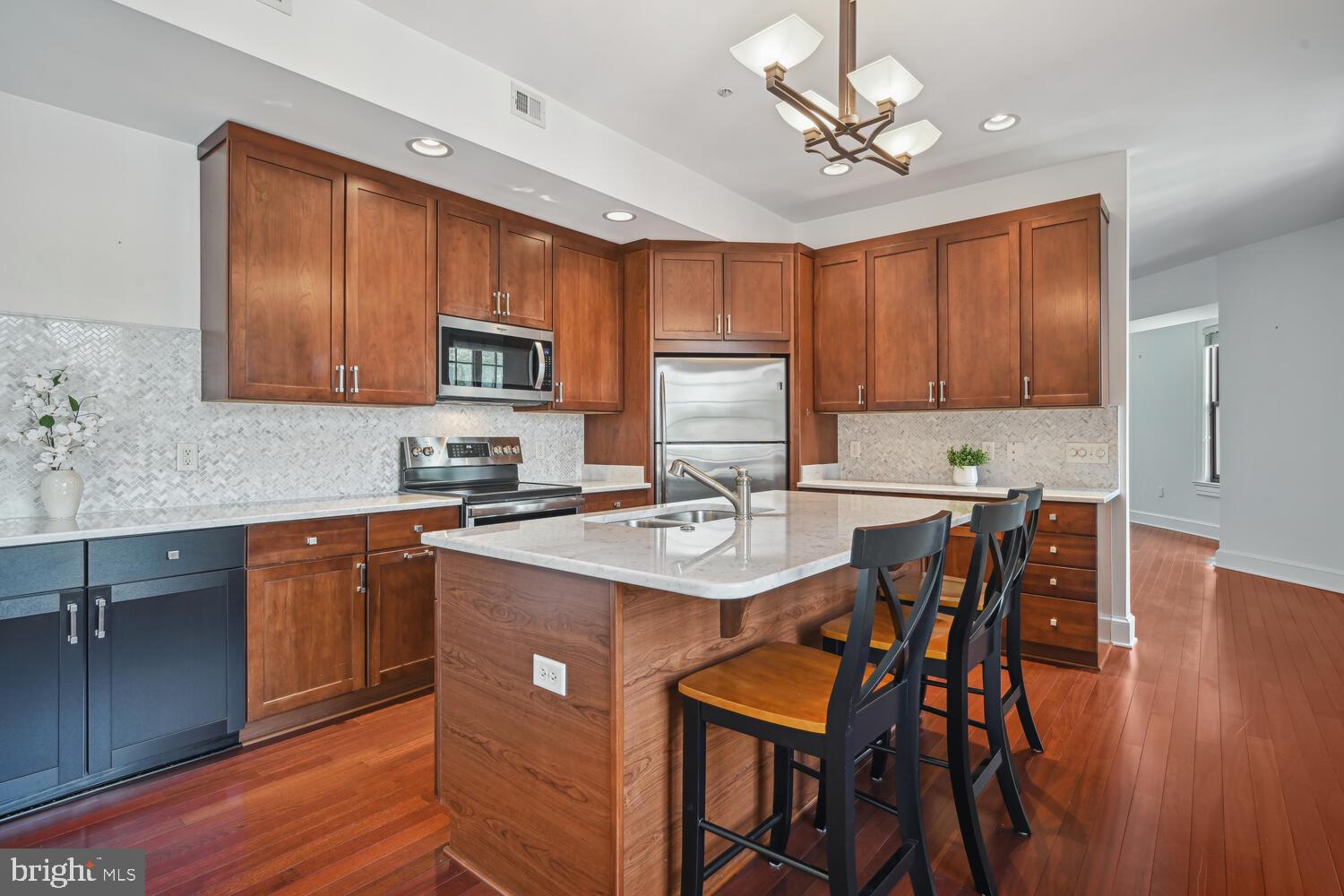 9610 Dewitt Drive, Unit B414 Silver Spring, MD 20910 - Photo 7 of 31 Enjoy meals & entertaining in center island