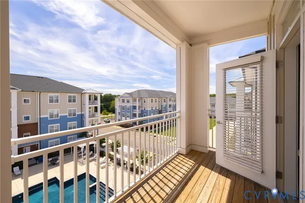 a view of balcony with wooden floor