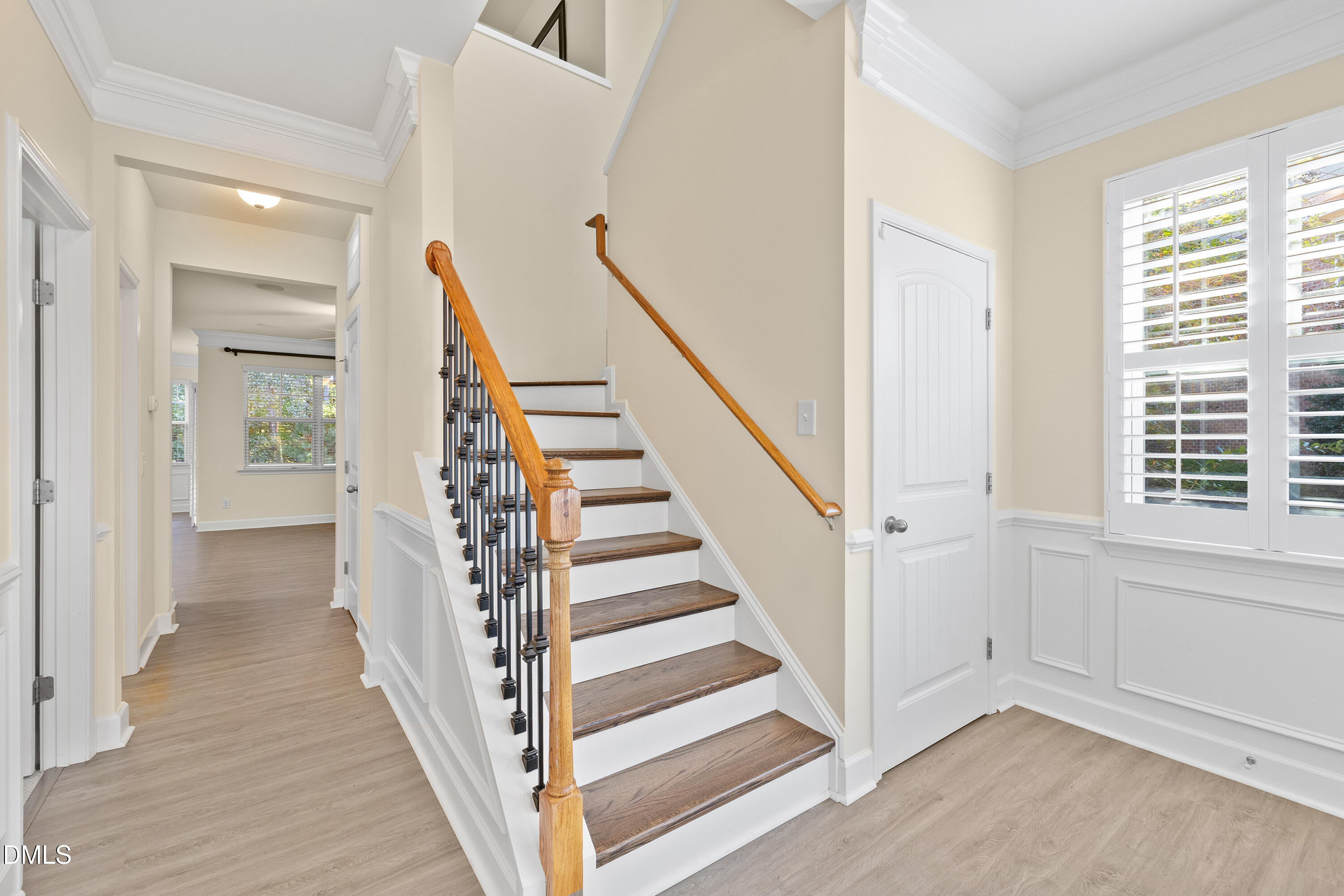 2063 Weston Green Loop Cary, NC 27513 - Photo 9 of 40 a view of a hallway with wooden floor and entryway