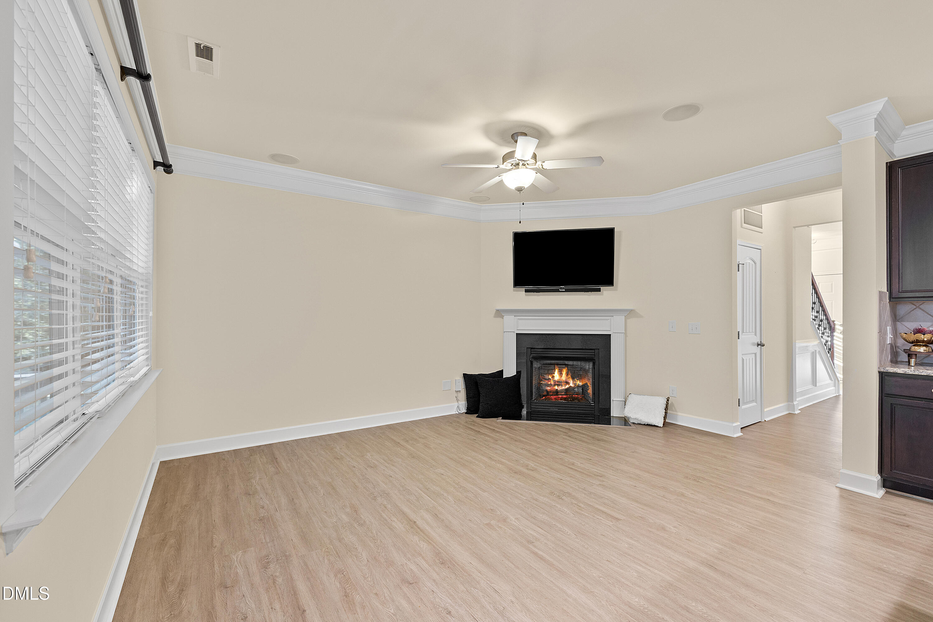 2063 Weston Green Loop Cary, NC 27513 - Photo 14 of 40 a view of empty room with a fireplace and fan