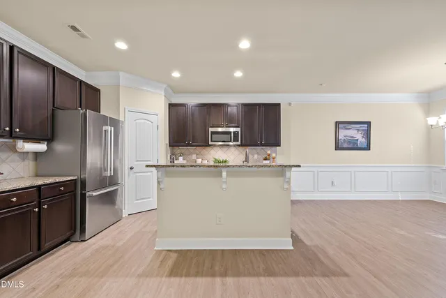 a view of empty room with a fireplace and fan