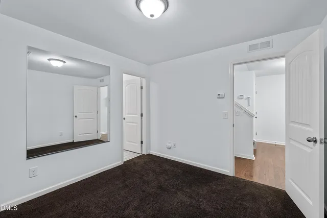 a kitchen with granite countertop stainless steel appliances a sink stove and cabinets