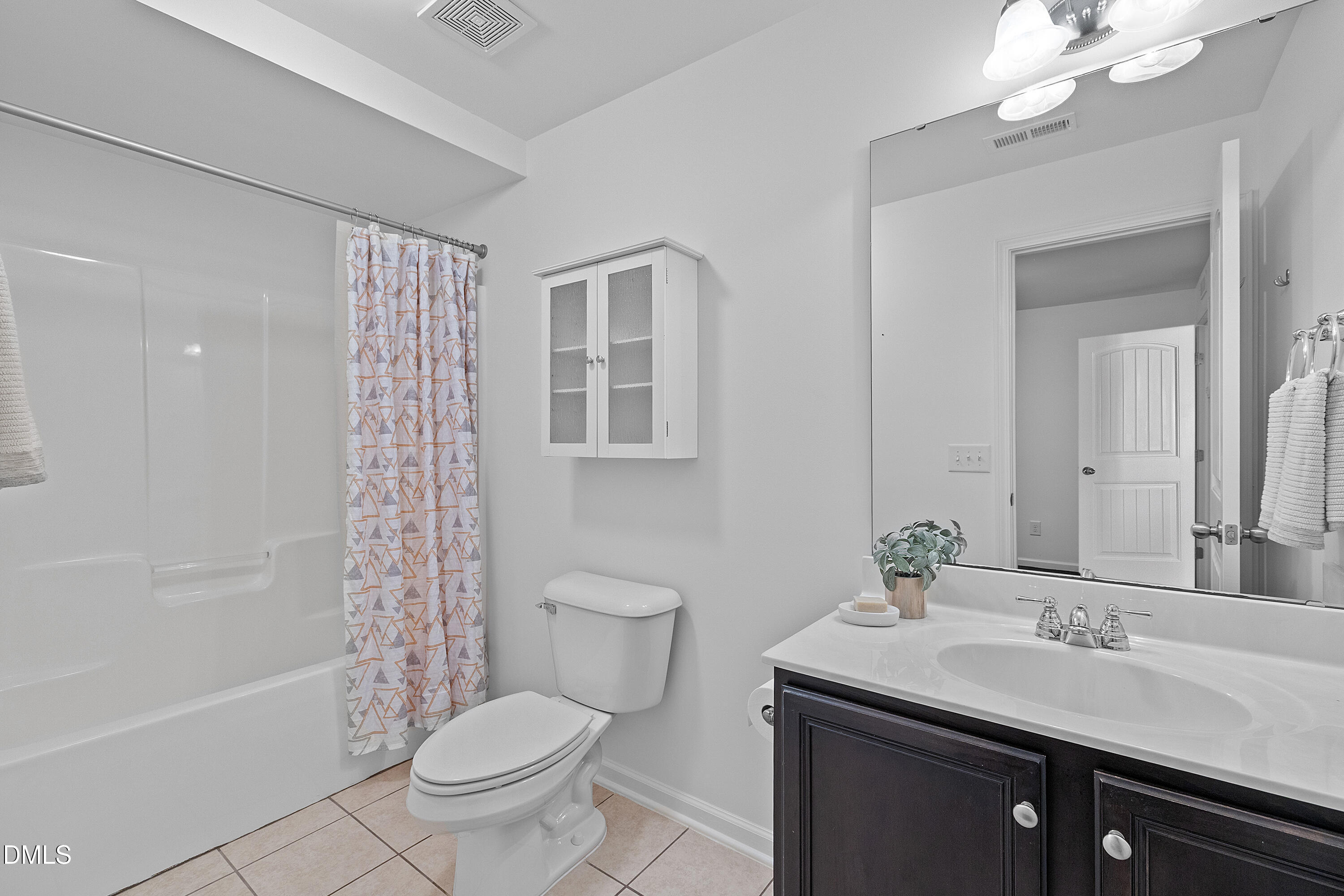 2063 Weston Green Loop Cary, NC 27513 - Photo 21 of 40 a bathroom with a granite countertop sink toilet and shower