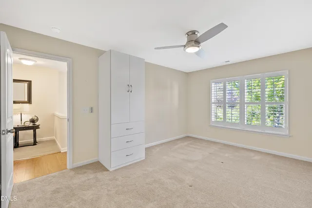 a view of a kitchen cabinets and wooden floor