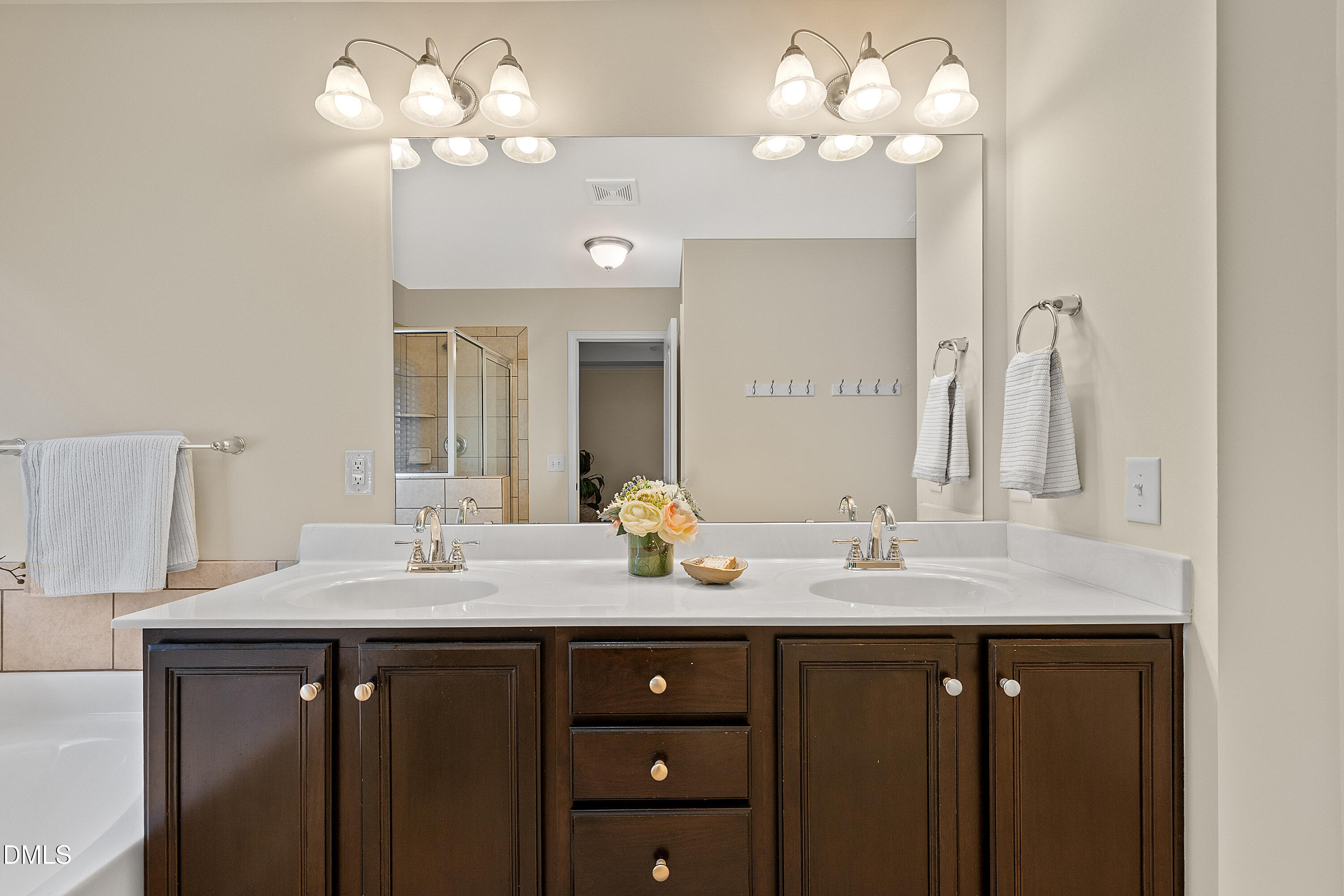 2063 Weston Green Loop Cary, NC 27513 - Photo 30 of 40 a bathroom with a sink vanity and a mirror