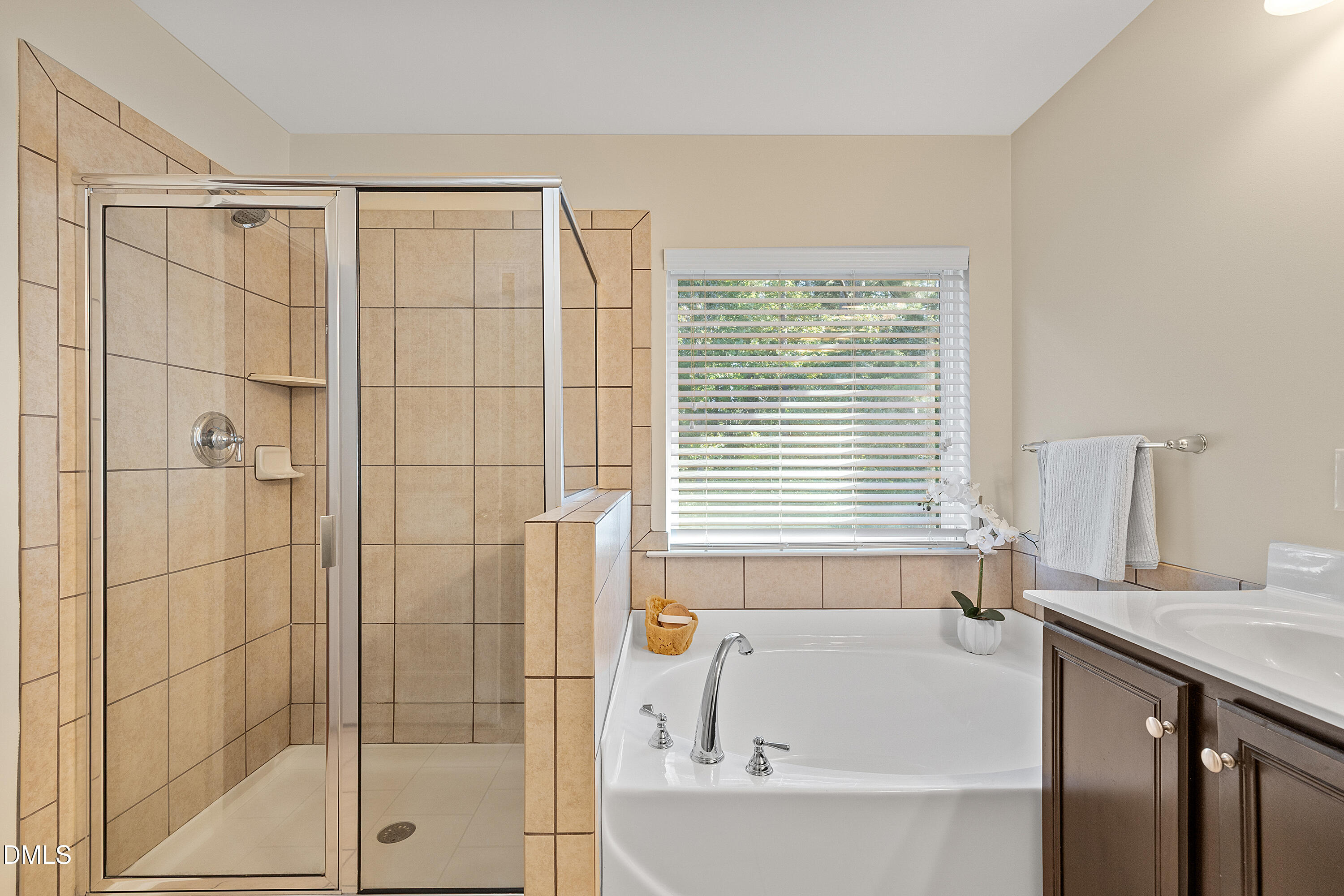 2063 Weston Green Loop Cary, NC 27513 - Photo 32 of 40 a bathroom with a bathtub and a shower