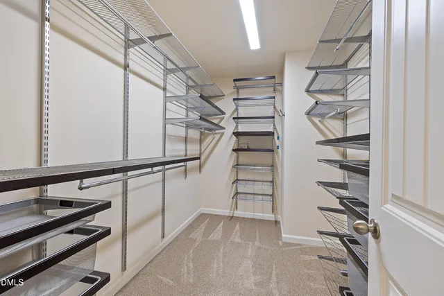a bathroom with a granite countertop sink mirror bathtub and next to a window