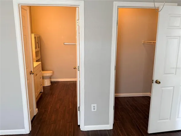 a view of a bathroom with wooden floor