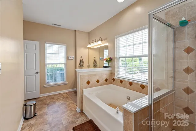 a room with pool table and windows