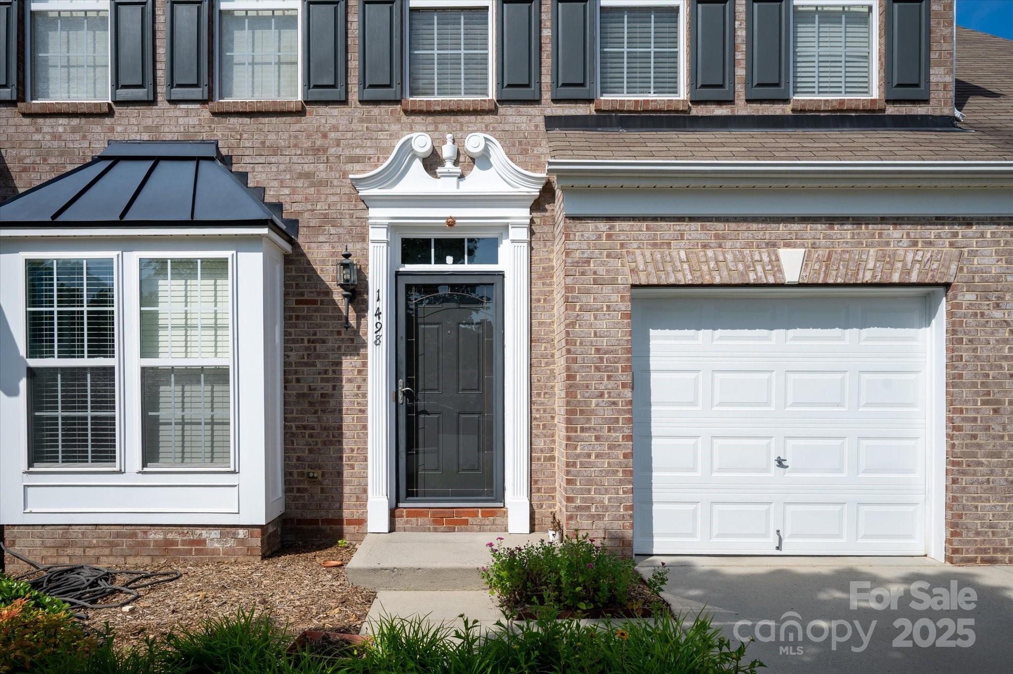 1498 Burrell Avenue Northwest Concord, NC 28027 - Photo 3 of 35 a view of entrance of the house with a yard