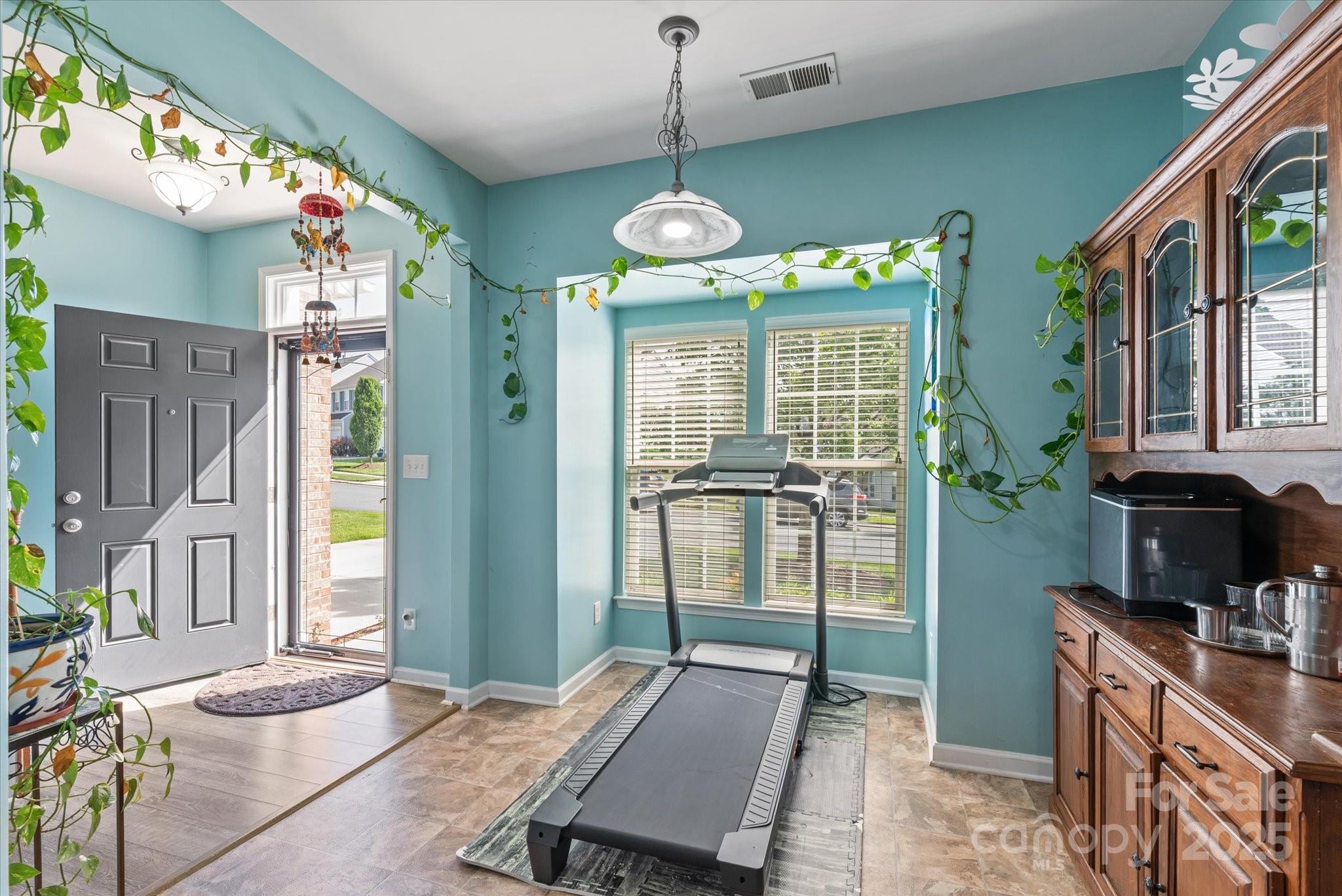 1498 Burrell Avenue Northwest Concord, NC 28027 - Photo 8 of 35 a room with musical instrument pool table and windows