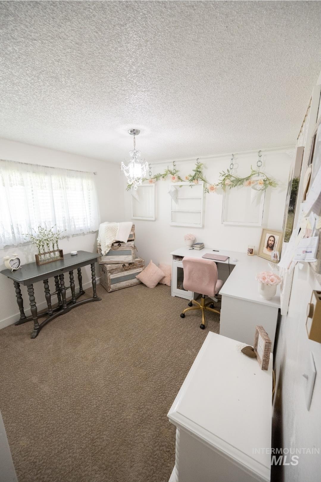 650 West 800 S Road Burley, ID 83318 - Photo 16 of 31 Carpeted home office featuring a chandelier and a textured ceiling