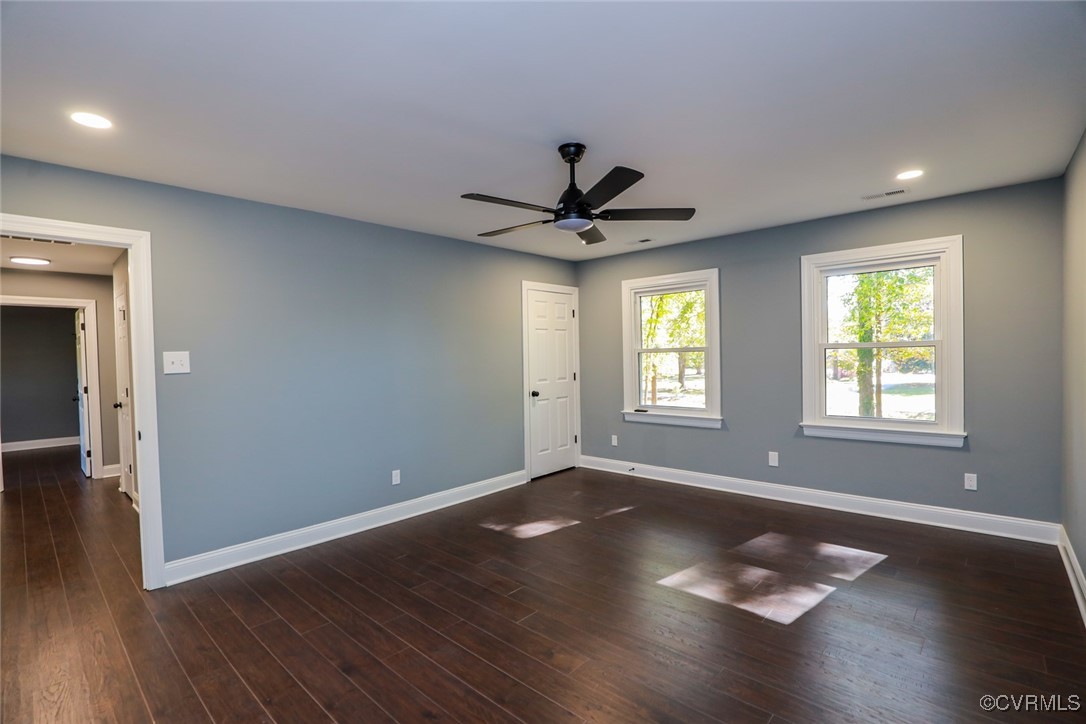 1130 Berryhill Road Henrico, VA 23231 - Photo 15 of 50 Empty room with ceiling fan and dark hardwood / wo