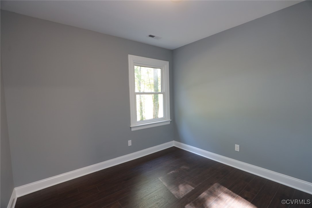 1130 Berryhill Road Henrico, VA 23231 - Photo 23 of 50 Unfurnished room with dark hardwood / wood-style f