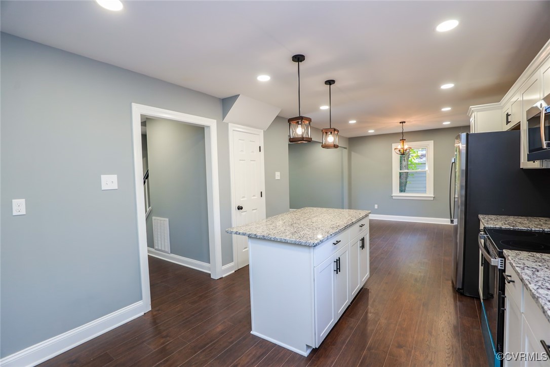 1130 Berryhill Road Henrico, VA 23231 - Photo 7 of 50 Kitchen with white cabinetry, electric stove, pend