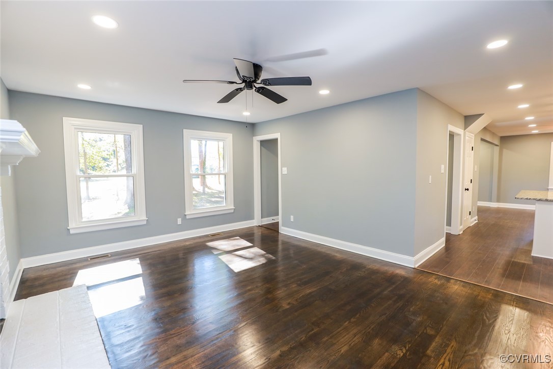 1130 Berryhill Road Henrico, VA 23231 - Photo 9 of 50 Spare room with dark wood-type flooring, a brick f