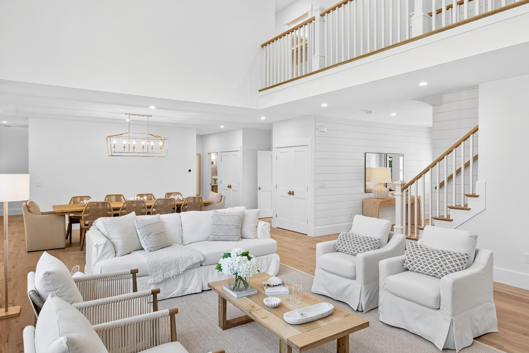 79 Rivers Edge Road East Falmouth, MA 02536 - Photo 11 of 104 a living room with furniture a rug and a chandelier