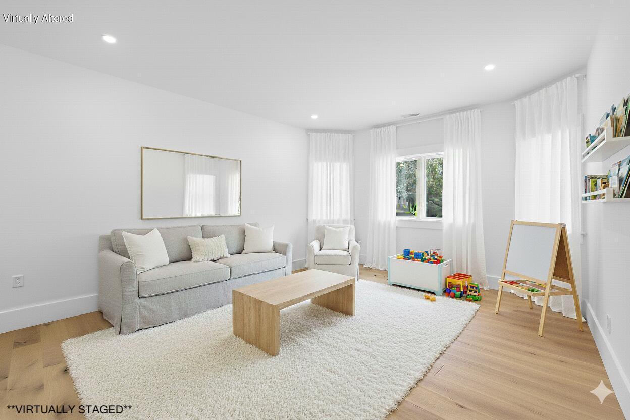 79 Rivers Edge Road East Falmouth, MA 02536 - Photo 27 of 104 a living room with furniture and a wooden floor