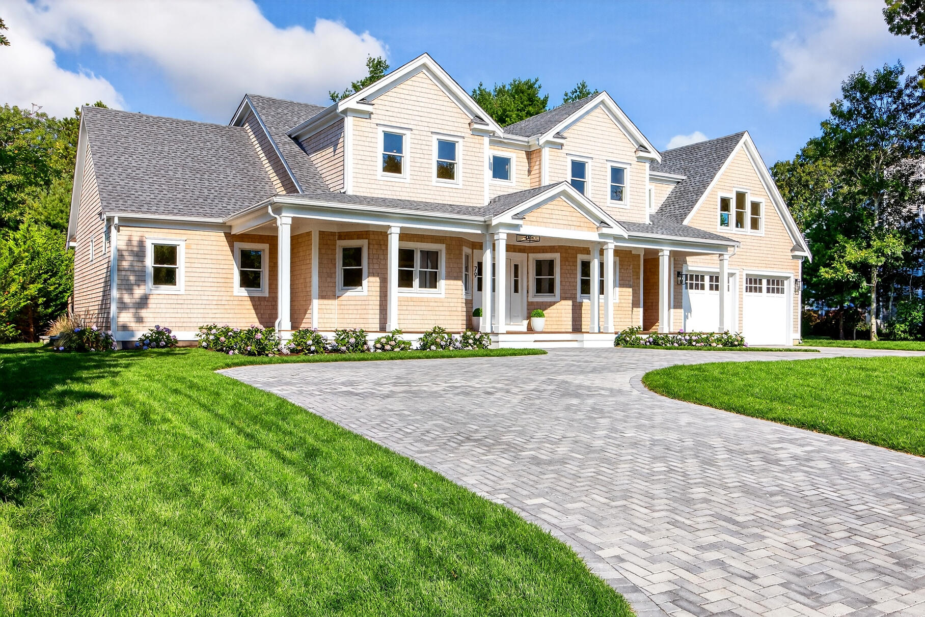 79 Rivers Edge Road East Falmouth, MA 02536 - Photo 3 of 104 a front view of a house with a garden and plants