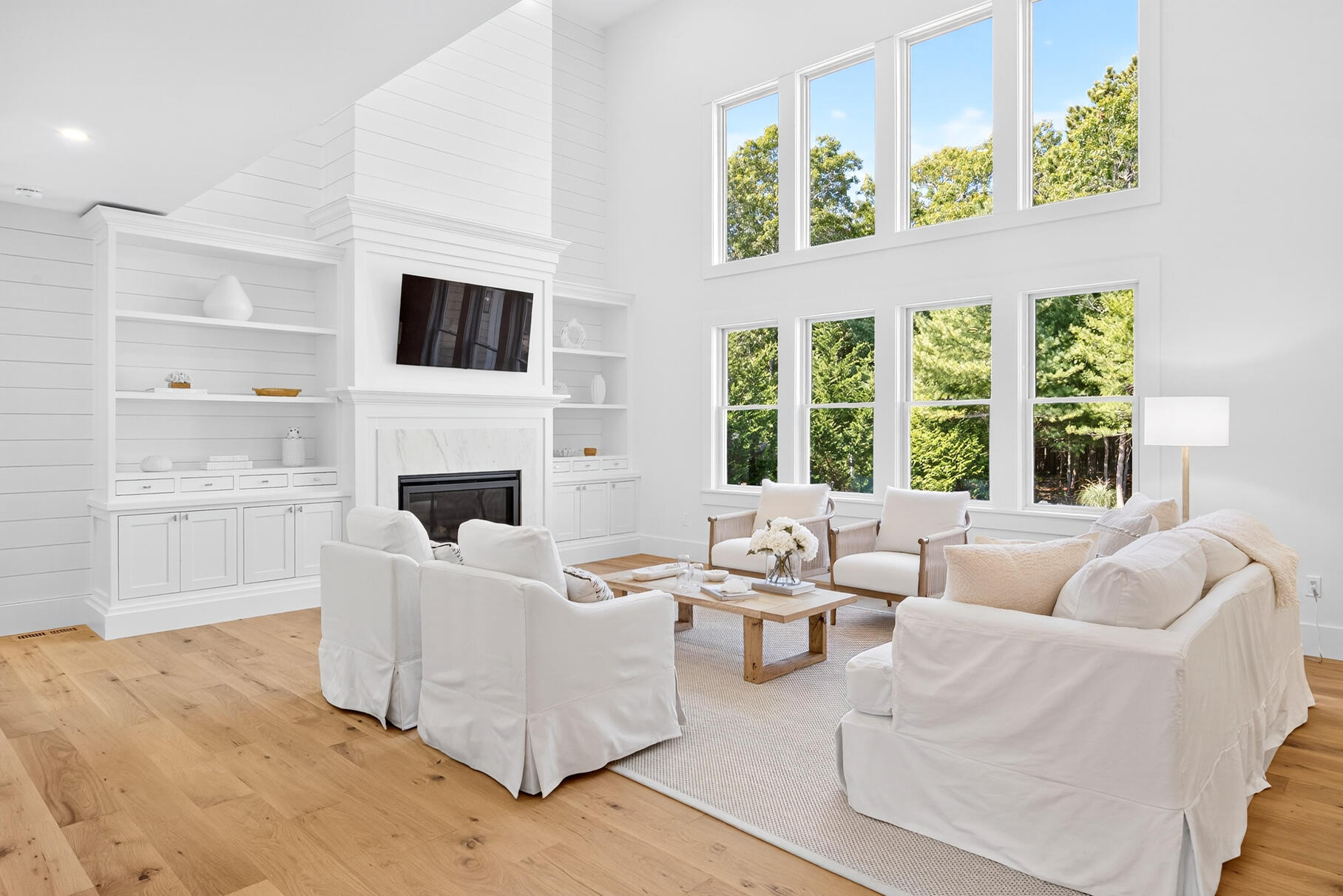 79 Rivers Edge Road East Falmouth, MA 02536 - Photo 31 of 104 a living room with furniture a fireplace and a flat screen tv