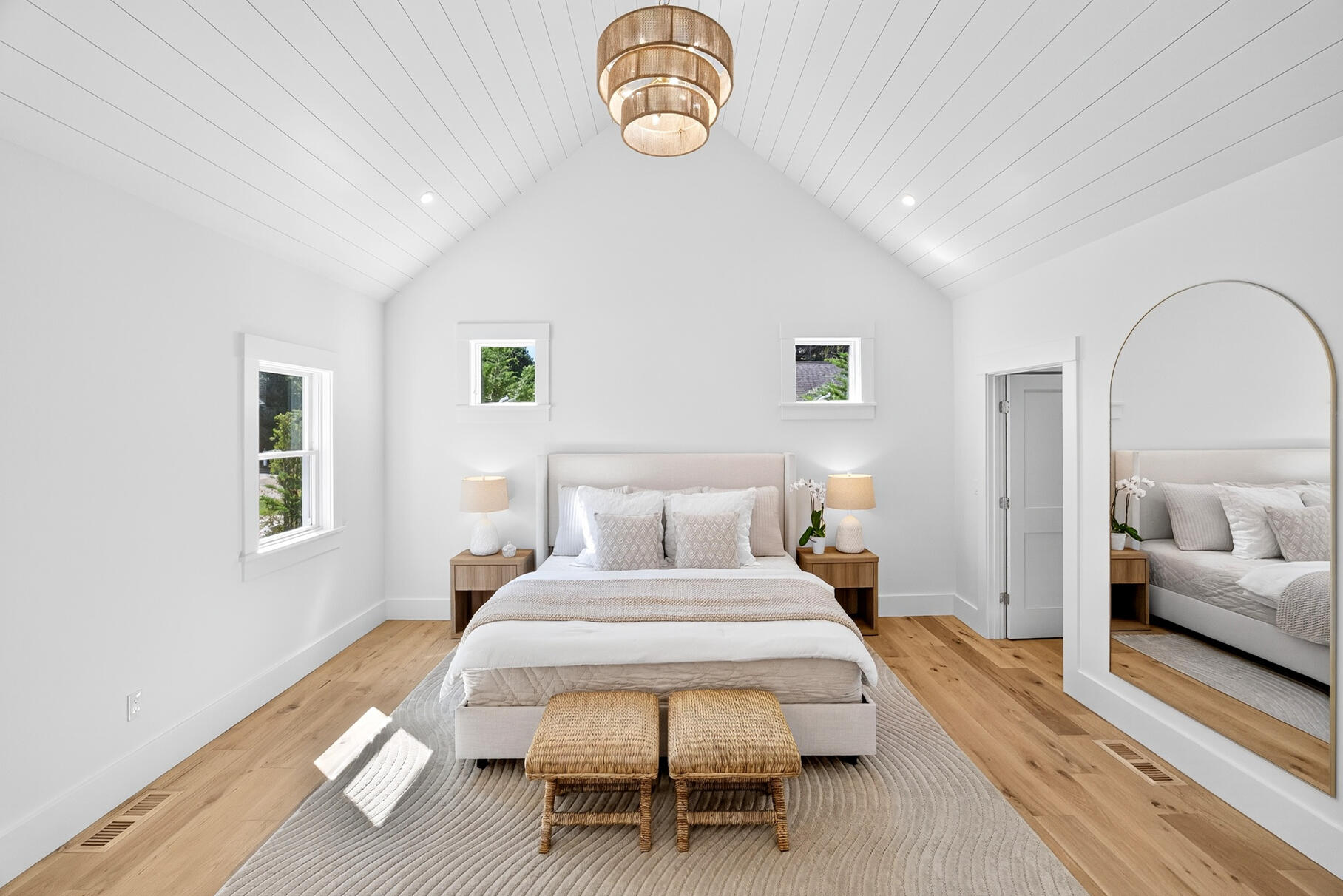 79 Rivers Edge Road East Falmouth, MA 02536 - Photo 33 of 104 a bedroom with a bed and a chandelier