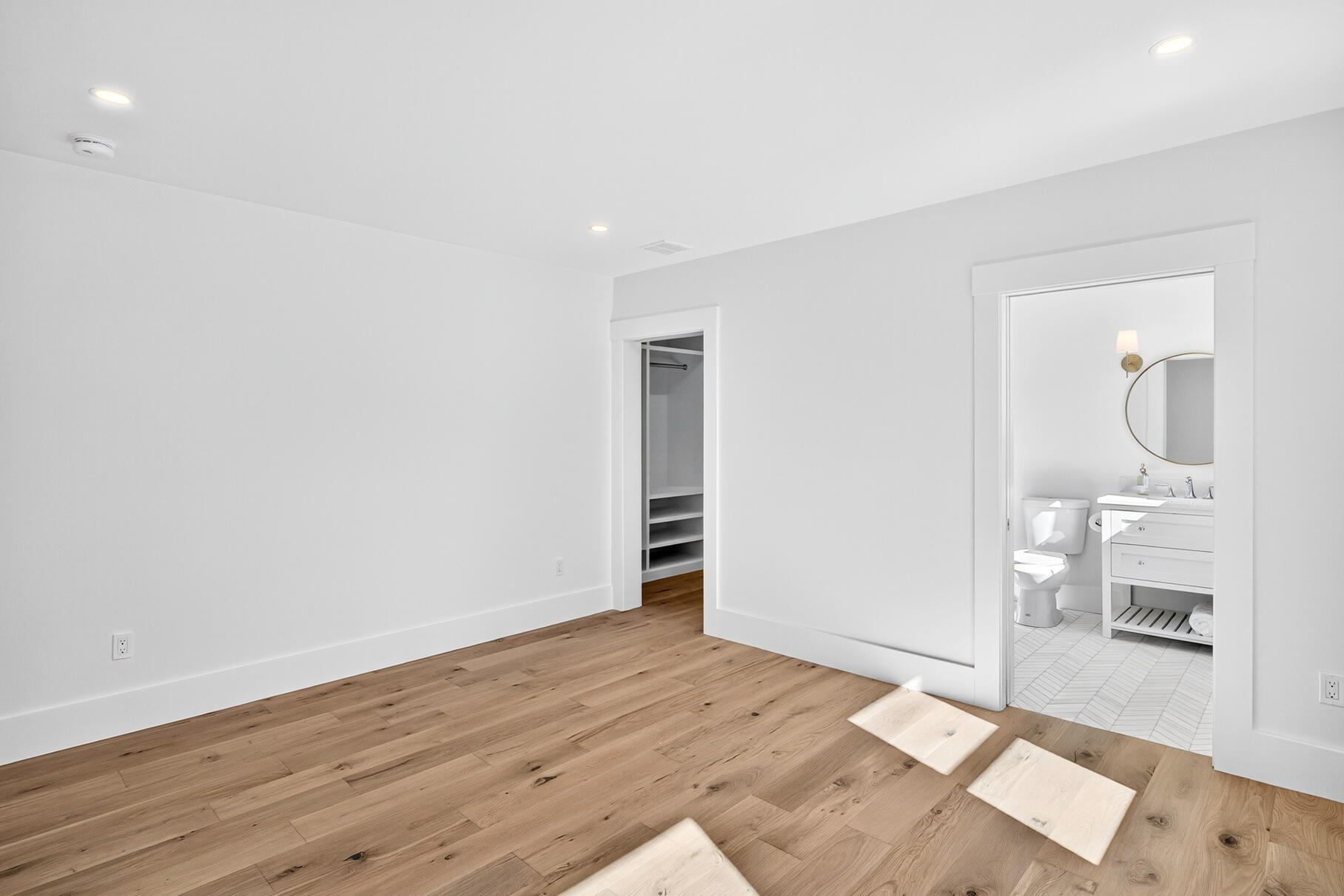79 Rivers Edge Road East Falmouth, MA 02536 - Photo 43 of 104 a view of an empty room with wooden floor and a bathroom