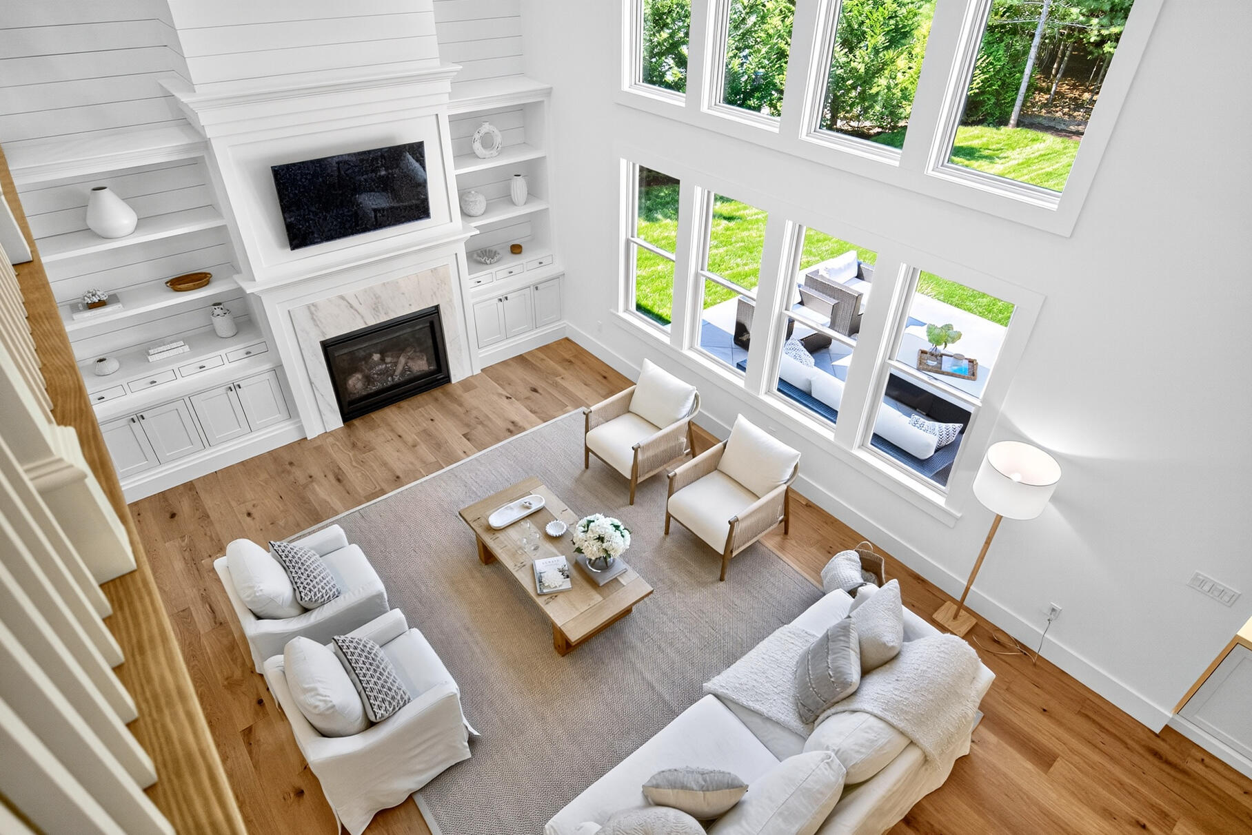 79 Rivers Edge Road East Falmouth, MA 02536 - Photo 49 of 104 a living room with furniture a fireplace and a flat screen tv